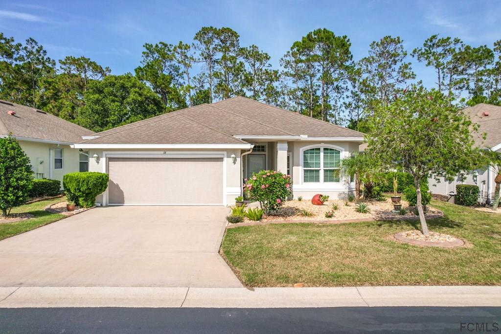 16 Raintree Circle Palm Coast, FL 32164 - Photo 44 of 45 a house that has a tree in front of it