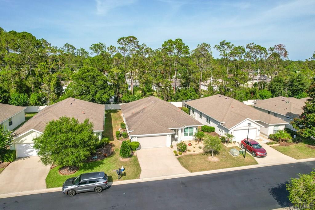 16 Raintree Circle Palm Coast, FL 32164 - Photo 45 of 45 an aerial view of a house with yard swimming pool and outdoor seating