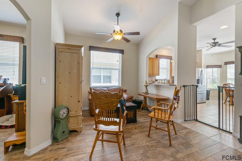 16 Raintree Circle Palm Coast, FL 32164 - Photo 9 of 45 a view of a livingroom with furniture and a window