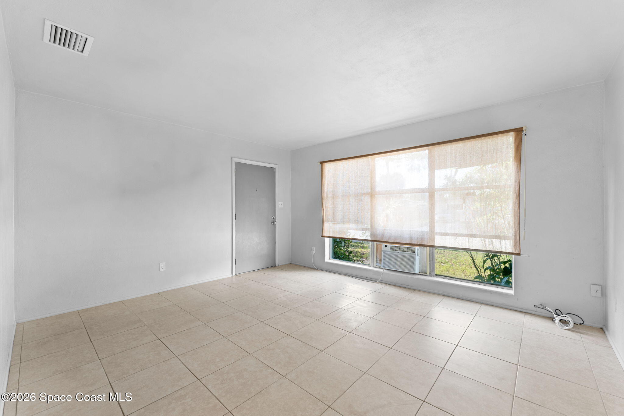 1042 Azalea Lane Cocoa, FL 32922 - Photo 6 of 26 an empty room with large window
