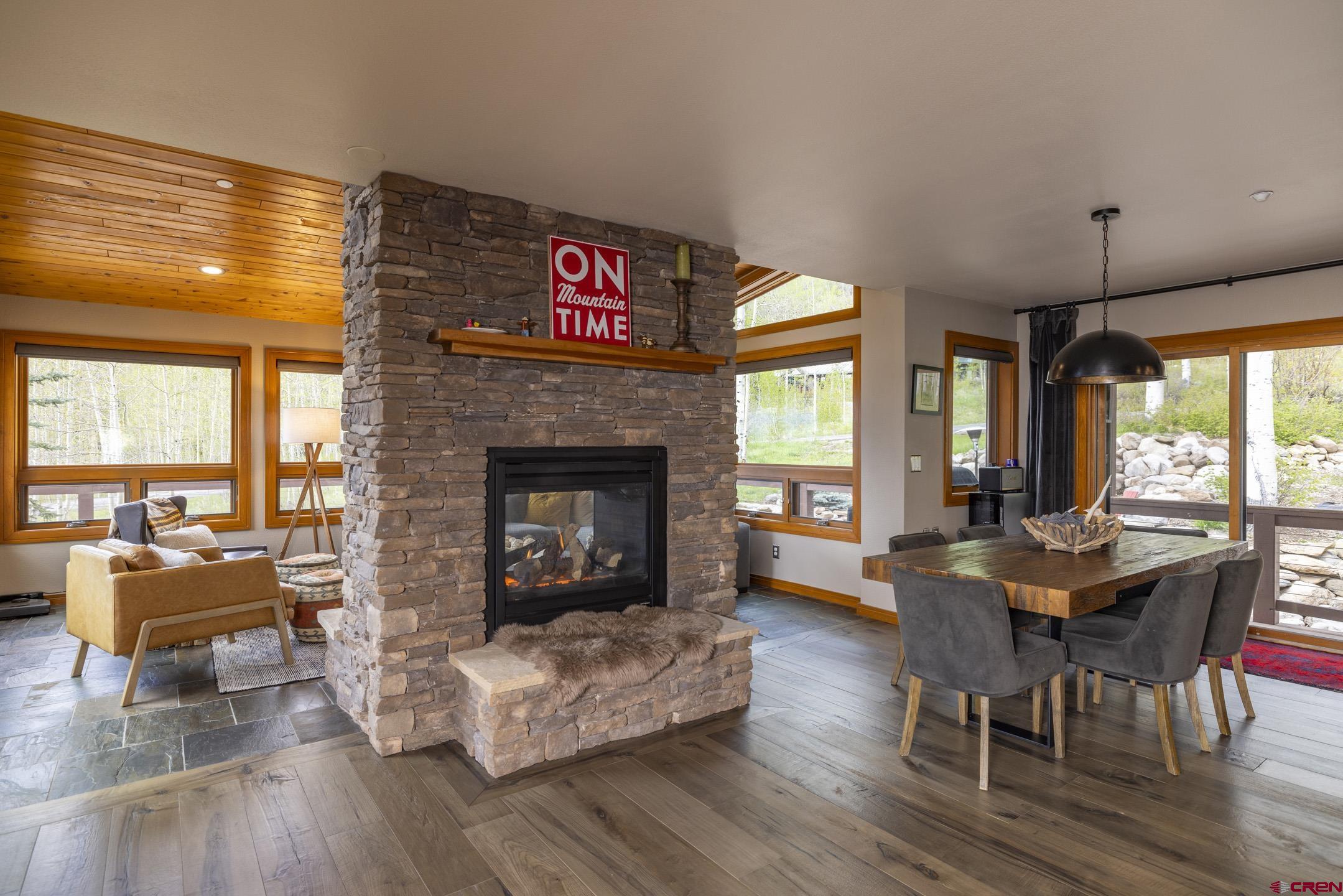 154 Falcon Ridge Road Durango, CO 81301 - Photo 7 of 42 a living room with furniture and a fireplace