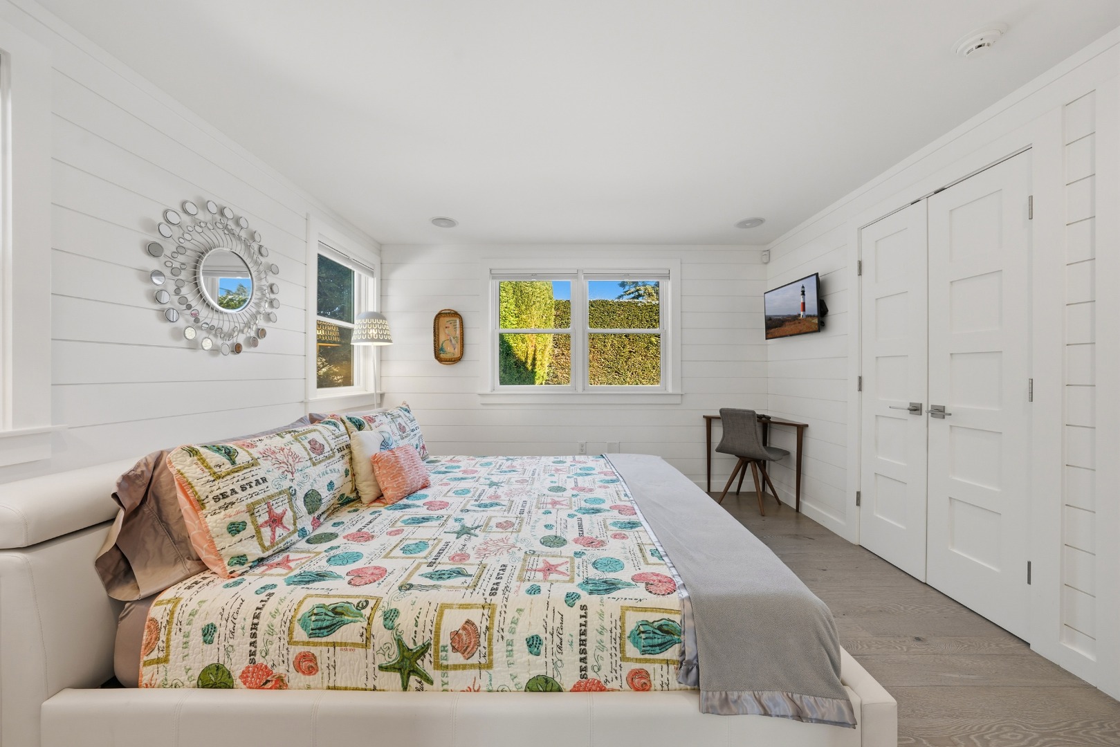 10 Pilgrim Road Nantucket, MA 02554 - Photo 23 of 65 a bedroom with a bed and a table in it
