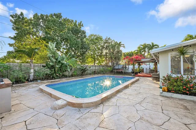 a view of swimming pool with seating space