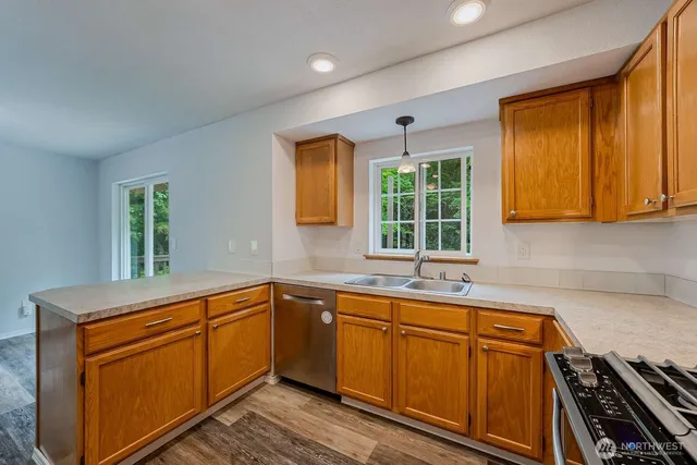 a kitchen with sink cabinets and window
