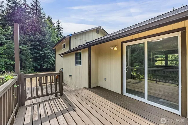 a view of a house with a wooden deck