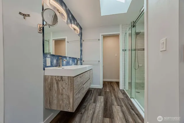 a bathroom with a sink and a mirror