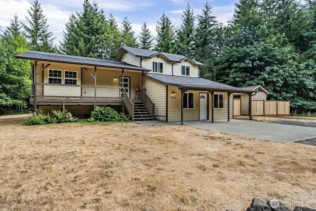 a front view of a house with a garden