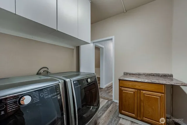 a utility room with dryer and washer