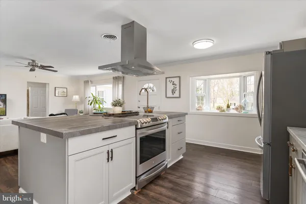 a kitchen with sink cabinets and window