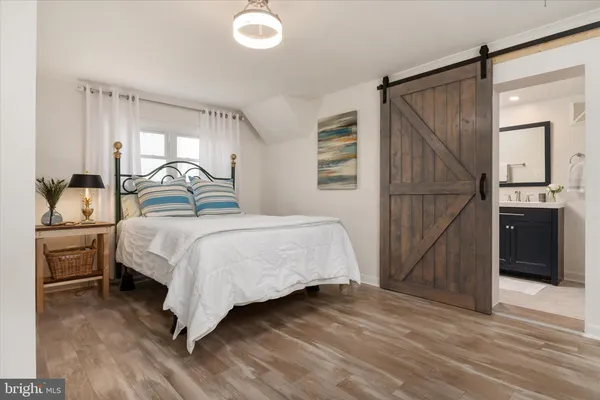 a view of a room with furniture wooden floor and a window