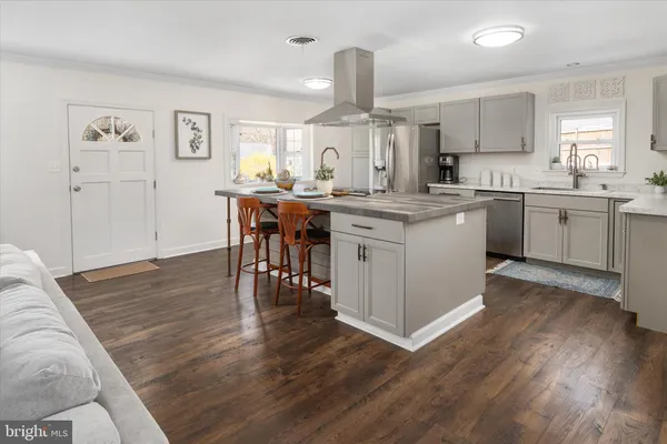 a kitchen with a window a sink and a cabinets