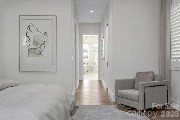 a bedroom with a bed and a lamp