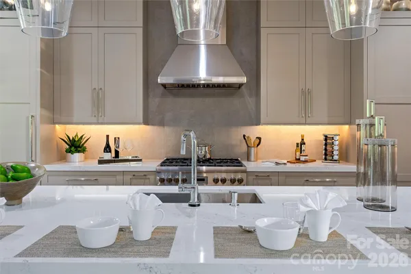 a bathroom with a double vanity sink toilet and a mirror