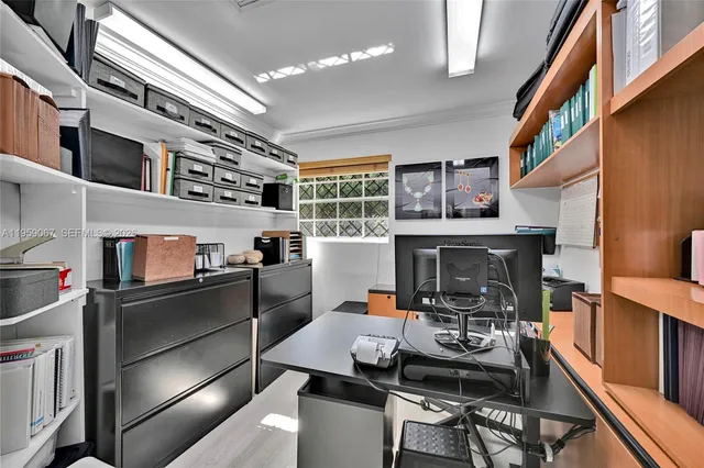 a kitchen with a sink appliances and cabinets