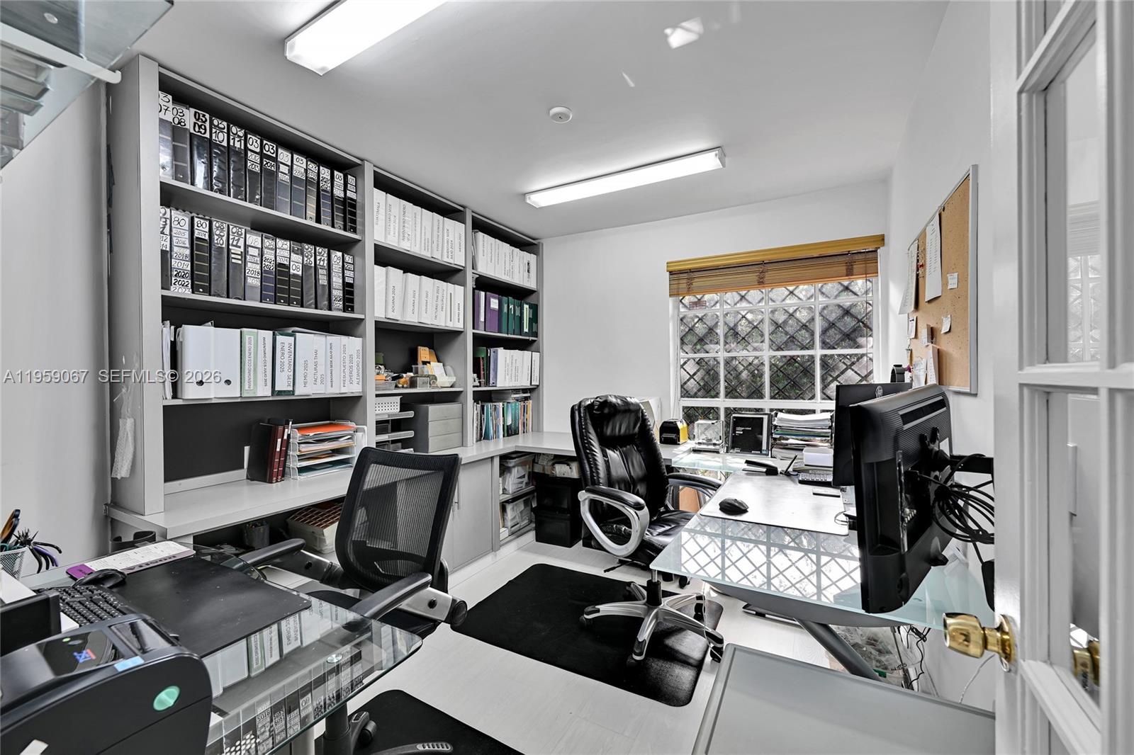 2212 Southwest 22nd Avenue Miami, FL 33145 - Photo 23 of 32 a view of a workspace with furniture and a window