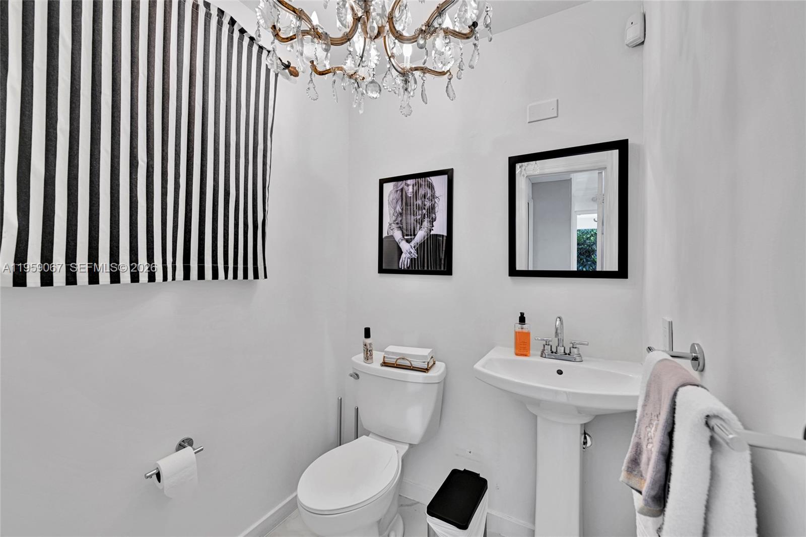 2212 Southwest 22nd Avenue Miami, FL 33145 - Photo 26 of 32 a bathroom with a sink mirror and toilet