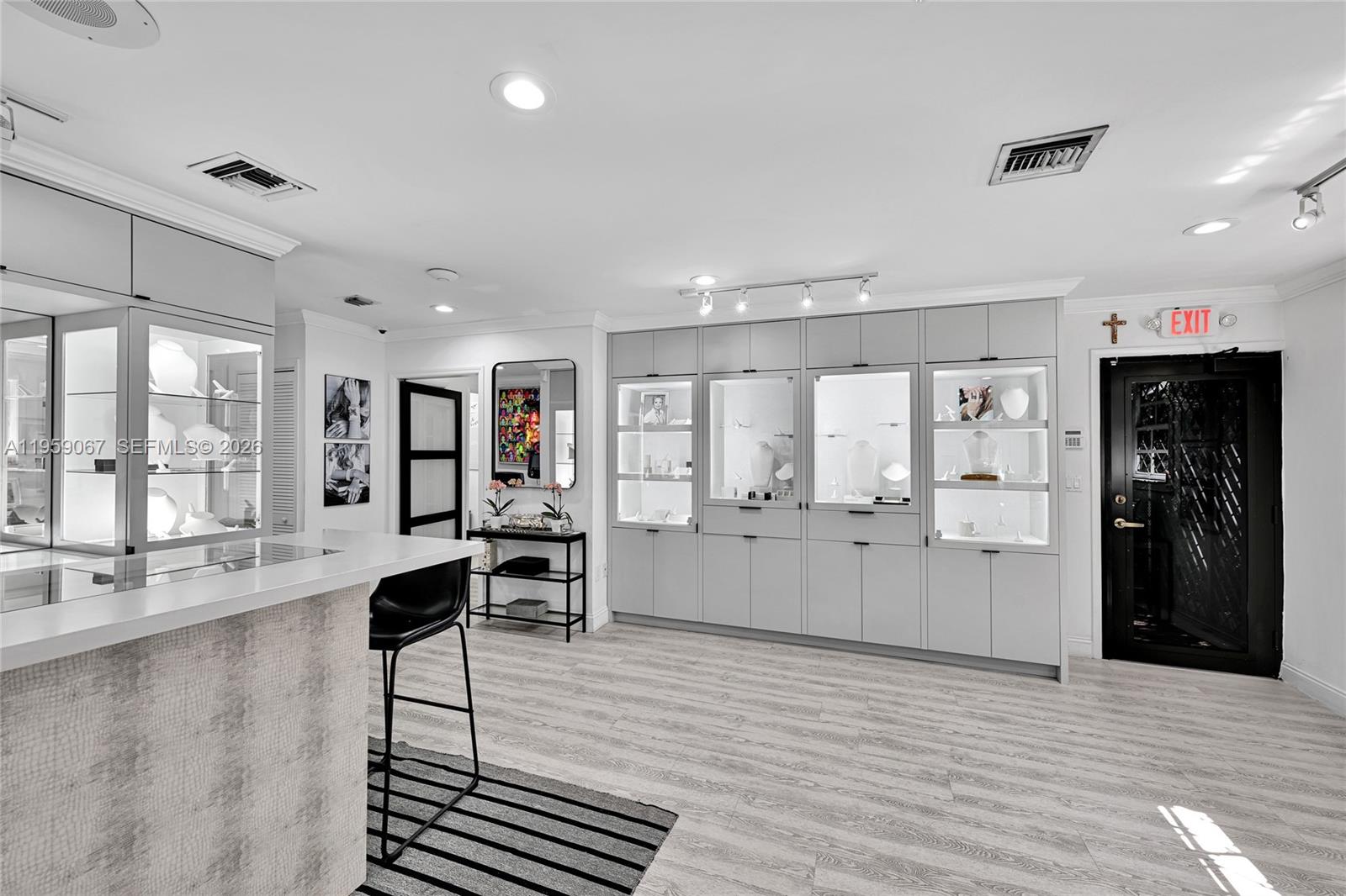 2212 Southwest 22nd Avenue Miami, FL 33145 - Photo 3 of 32 a large living room with stainless steel appliances kitchen island granite countertop furniture and a large window