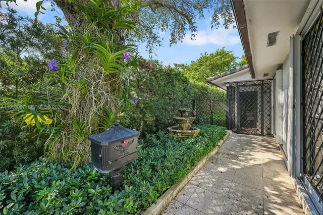 a backyard of a house with outdoor seating and green space