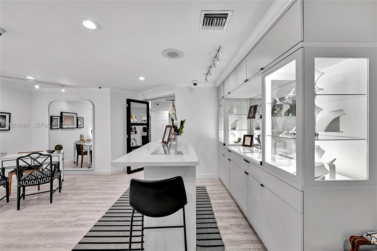 2212 Southwest 22nd Avenue Miami, FL 33145 - Photo 6 of 32 a large white kitchen with sink and wooden floor