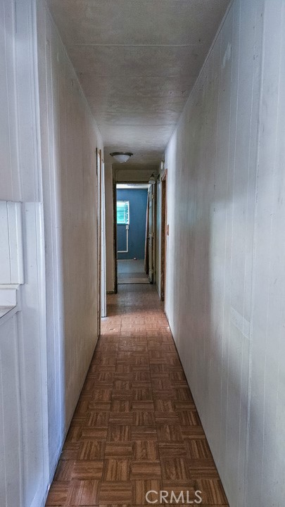 45800 Challenger Way, Unit 251 Lancaster, CA 93535 - Photo 5 of 7 a view of a hallway with wooden floor