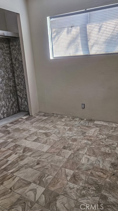 45800 Challenger Way, Unit 251 Lancaster, CA 93535 - Photo 6 of 7 a view of an empty room with a window