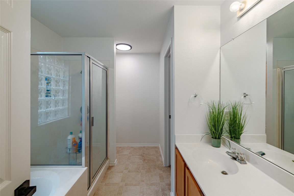 1130 Sundrop Place Round Rock, TX 78665 - Photo 10 of 19 a bathroom with a sink and a mirror