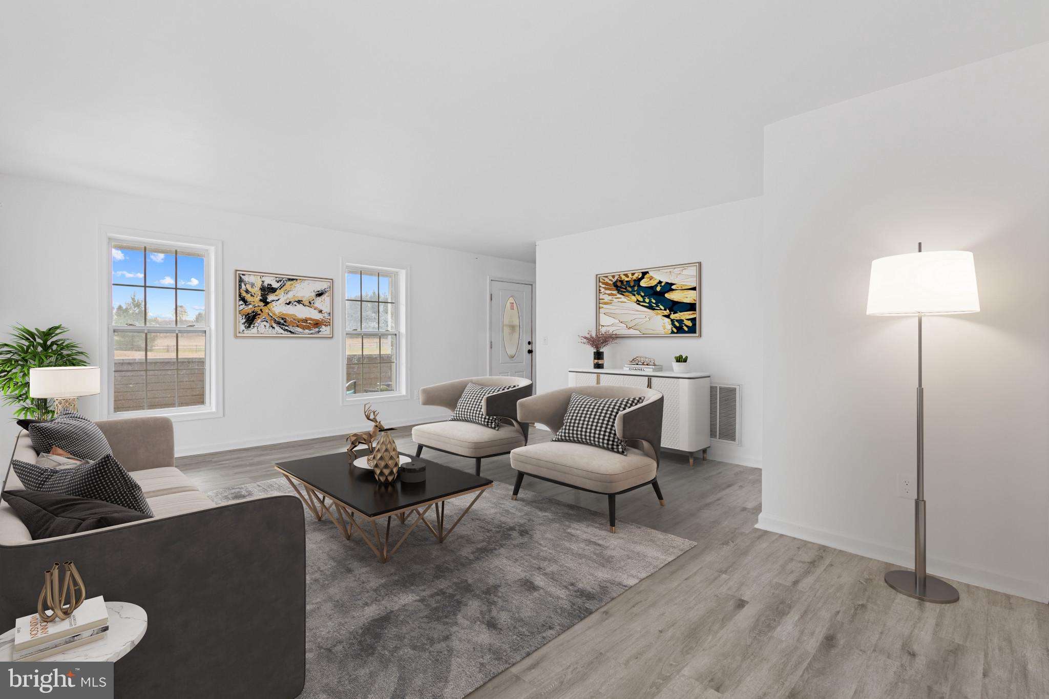 125 Oliver Guessford Road Townsend, DE 19734 - Photo 2 of 48 a living room with furniture and wooden floor