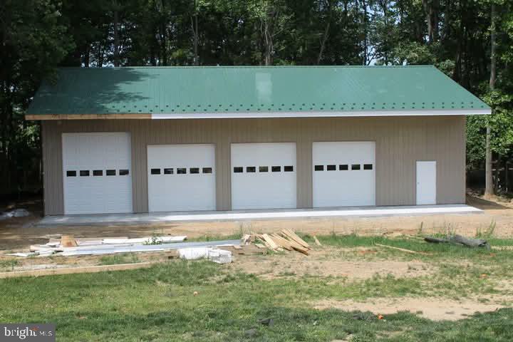 125 Oliver Guessford Road Townsend, DE 19734 - Photo 42 of 48 a front view of a house with a yard