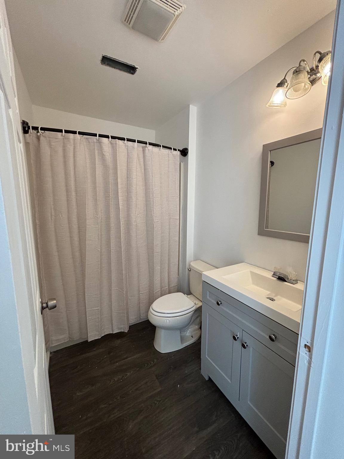 125 Oliver Guessford Road Townsend, DE 19734 - Photo 44 of 48 a bathroom with a toilet a sink and a mirror