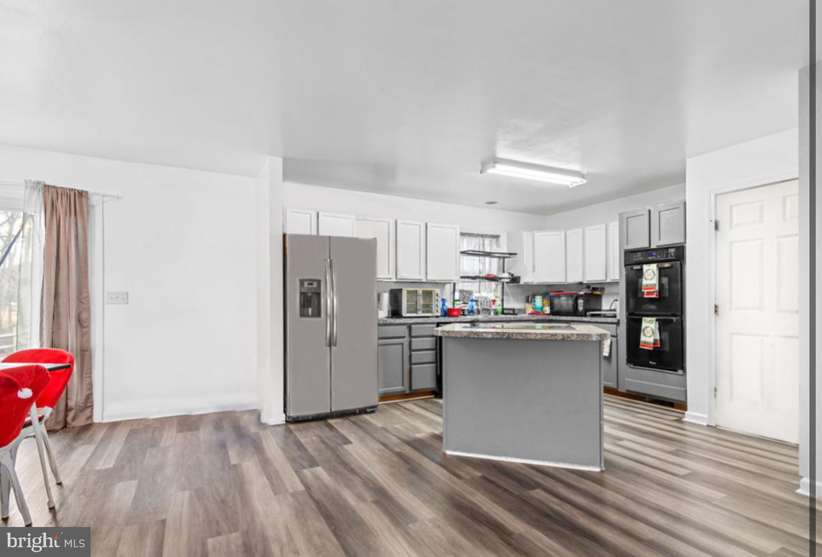 125 Oliver Guessford Road Townsend, DE 19734 - Photo 48 of 48 a kitchen with stainless steel appliances a refrigerator and a stove top oven