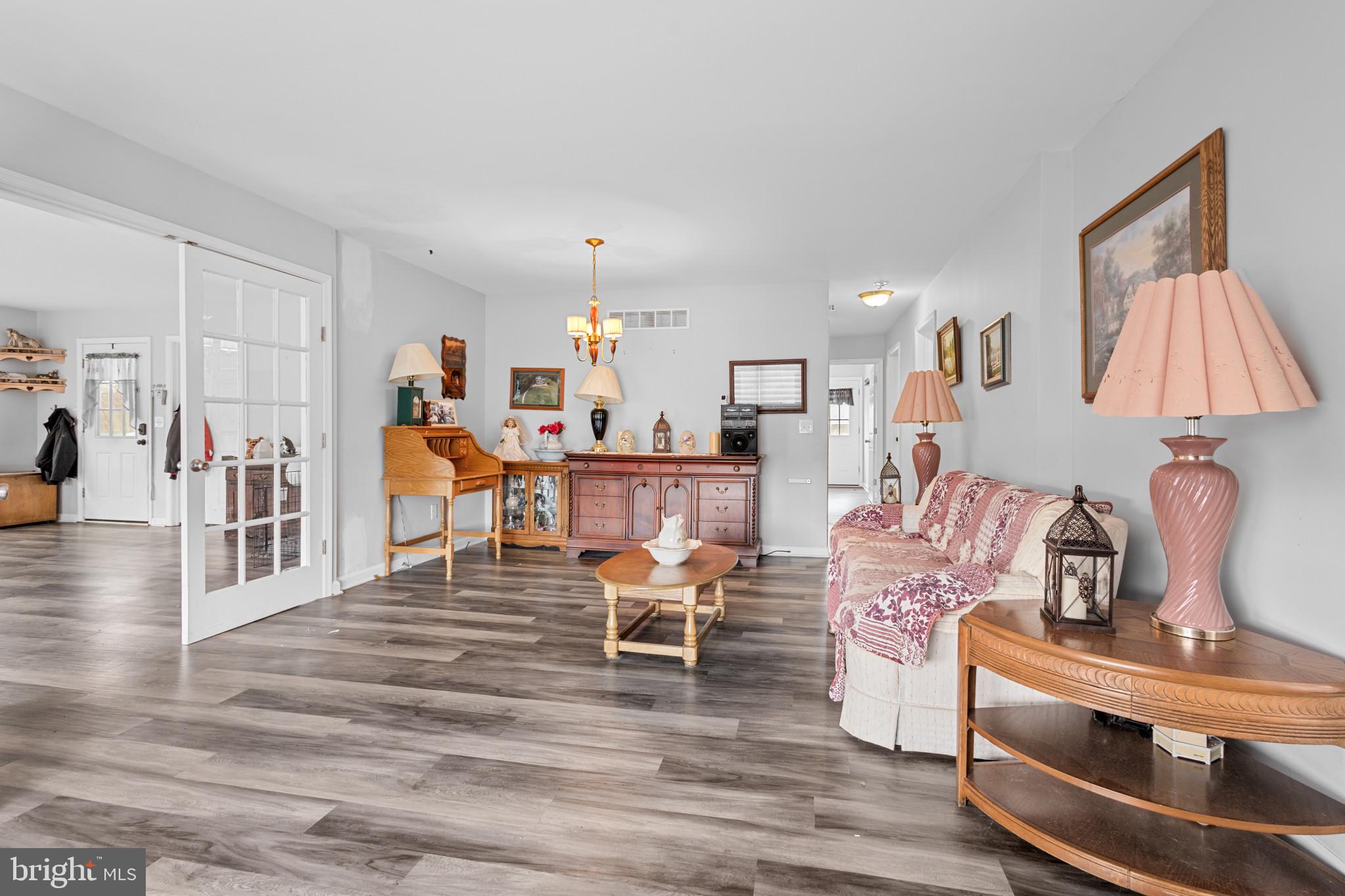 125 Oliver Guessford Road Townsend, DE 19734 - Photo 9 of 48 a living room with furniture and a flat screen tv