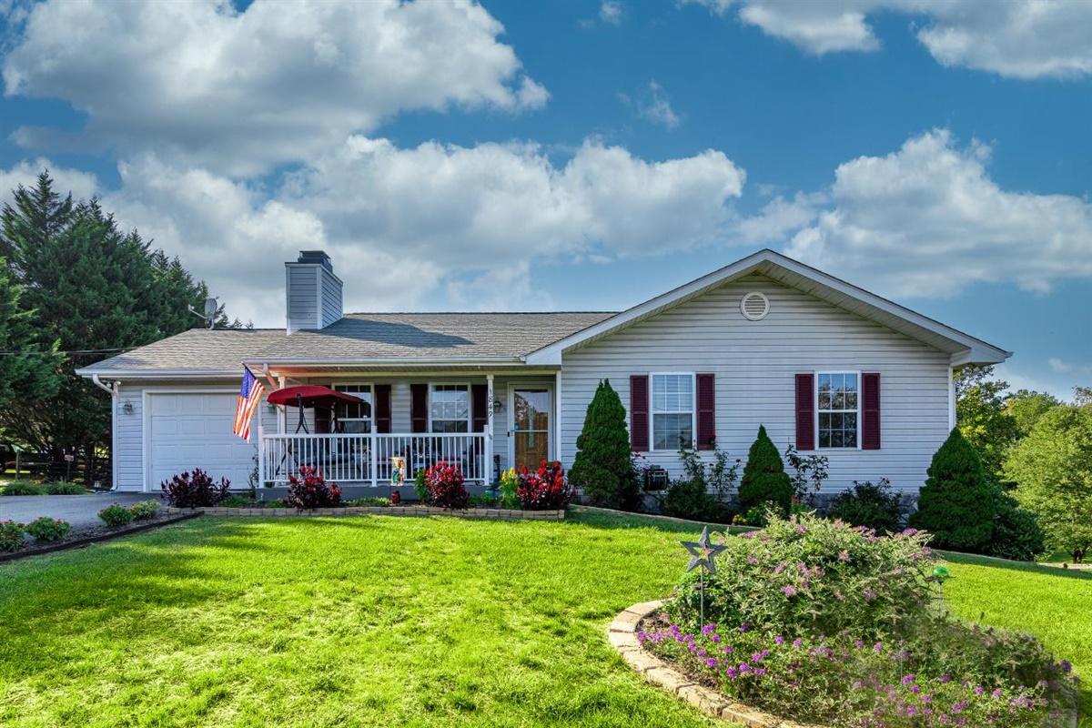 1849 Morgans Mill Road Goodview, VA 24095 - Photo 1 of 40 a front view of house with yard and green space