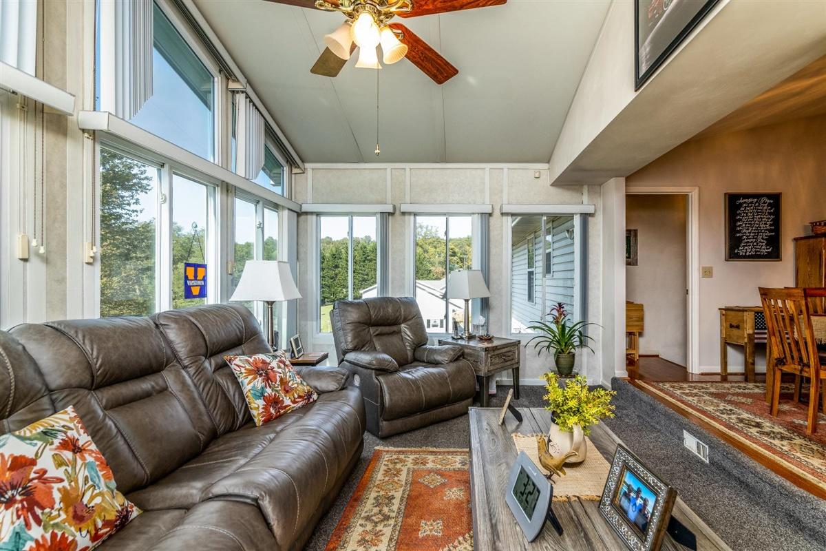 1849 Morgans Mill Road Goodview, VA 24095 - Photo 12 of 40 a living room with furniture and a large window