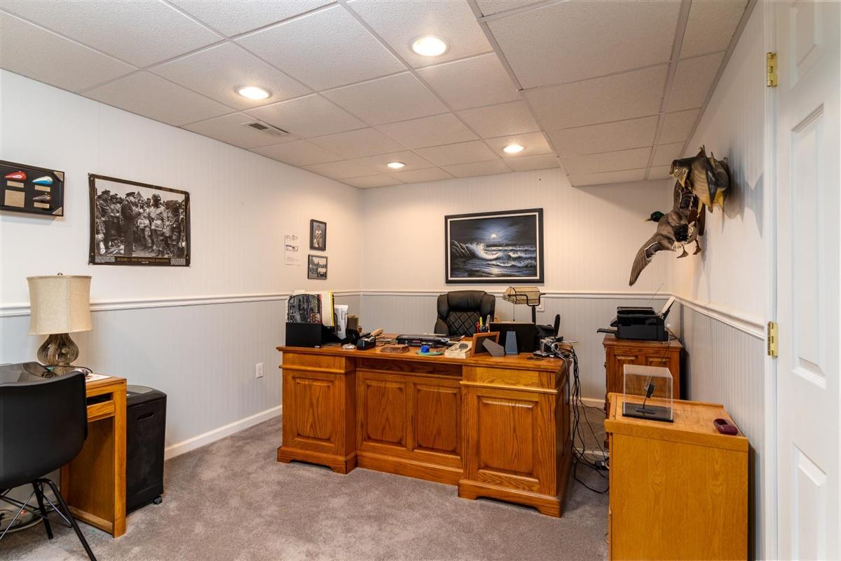 1849 Morgans Mill Road Goodview, VA 24095 - Photo 24 of 40 a room with furniture and a flat screen tv