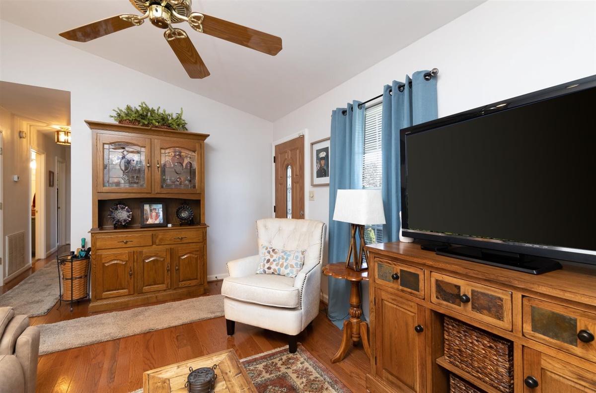 1849 Morgans Mill Road Goodview, VA 24095 - Photo 6 of 40 a living room with furniture and a flat screen tv