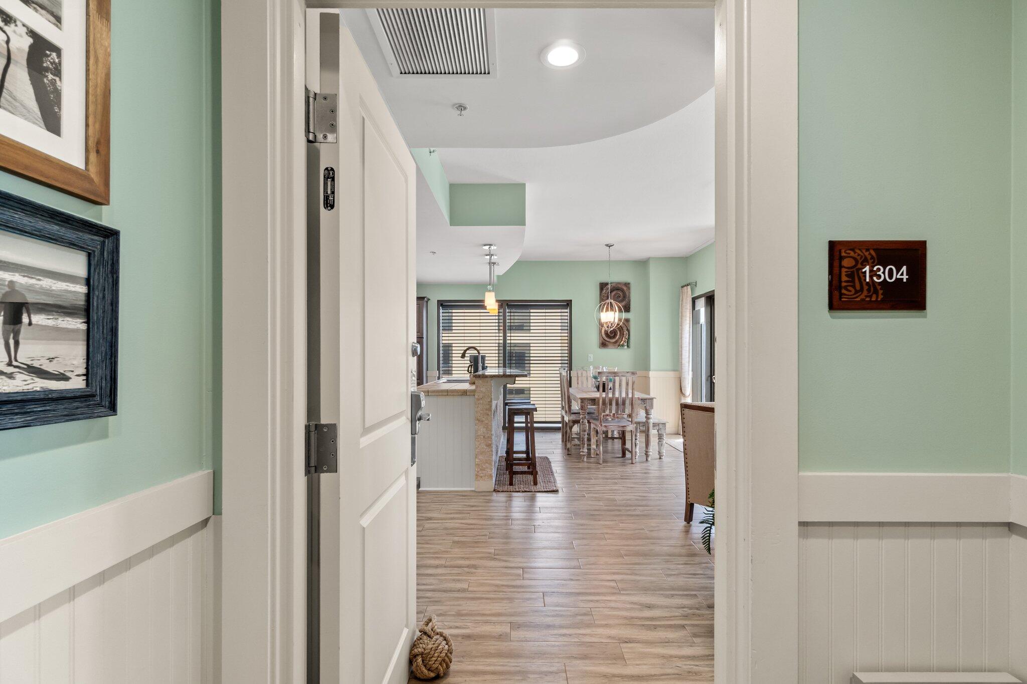 15100 Front Beach Road, Unit 1302 Panama City Beach, FL 32413 - Photo 17 of 67 a view of a living room with furniture and a wooden floor