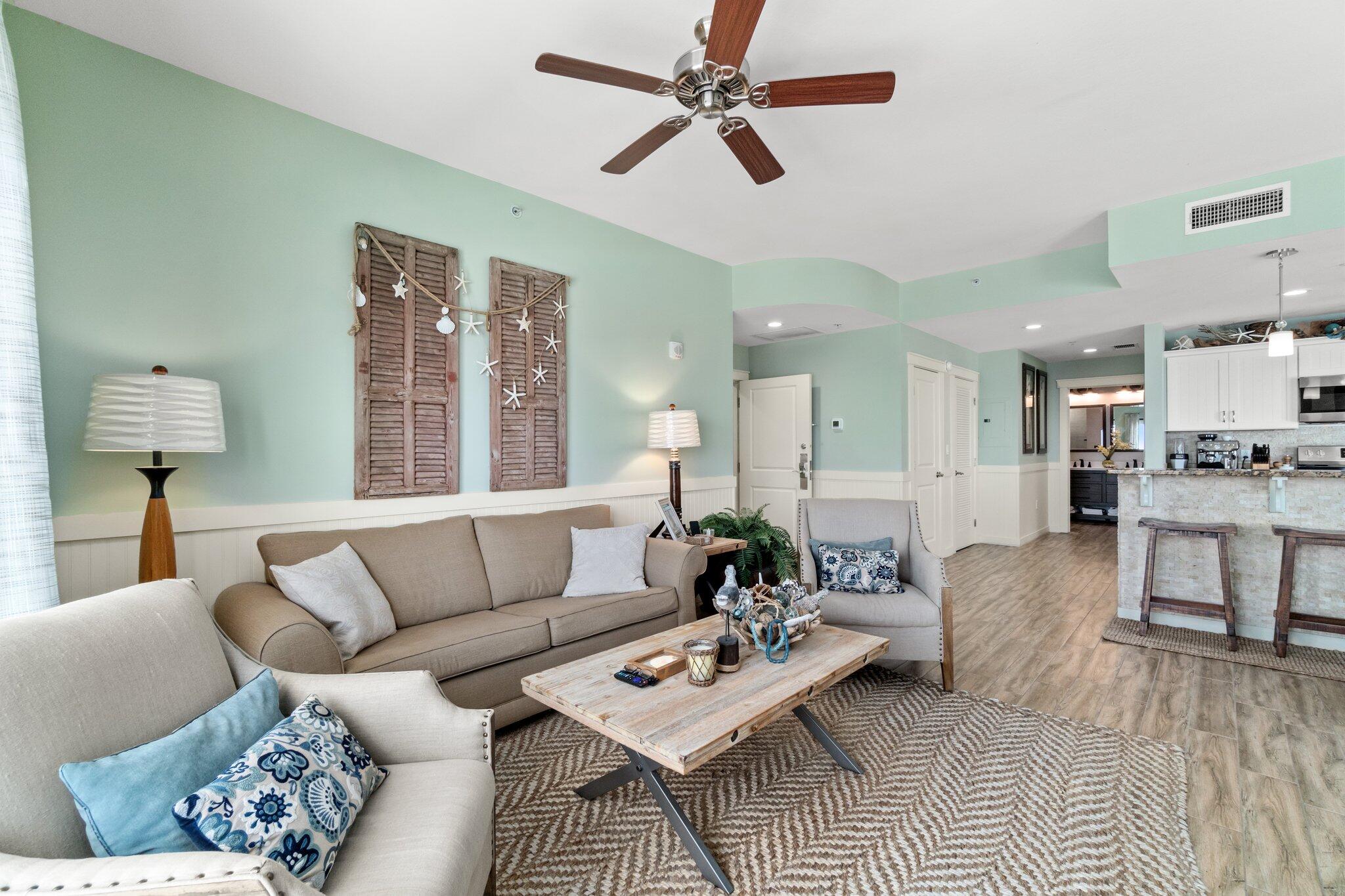 15100 Front Beach Road, Unit 1302 Panama City Beach, FL 32413 - Photo 22 of 67 a living room with furniture and a large window