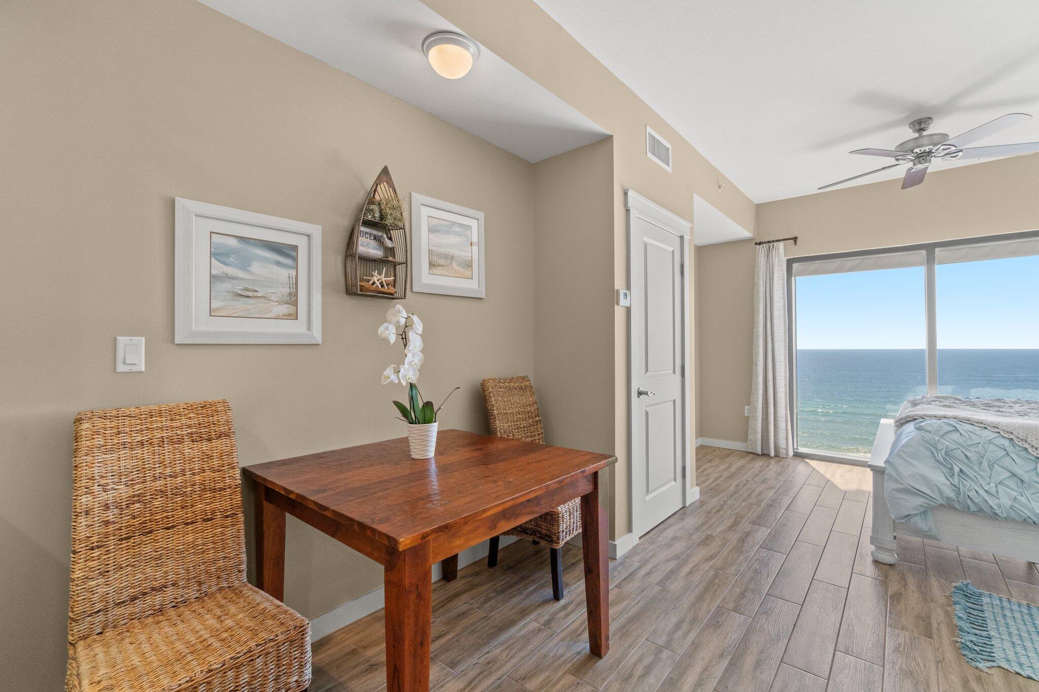 15100 Front Beach Road, Unit 1302 Panama City Beach, FL 32413 - Photo 40 of 67 a view of a workspace with furniture and wooden floor