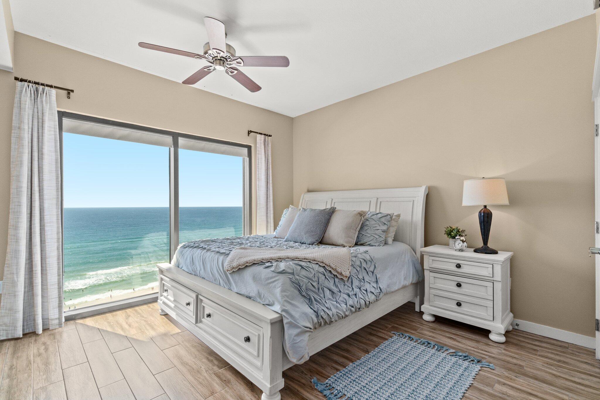 15100 Front Beach Road, Unit 1302 Panama City Beach, FL 32413 - Photo 43 of 67 a room with a bed and a view of balcony