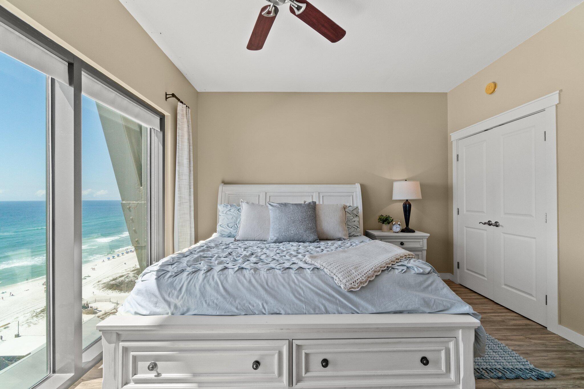 15100 Front Beach Road, Unit 1302 Panama City Beach, FL 32413 - Photo 45 of 67 a bedroom with a bed and next to a window