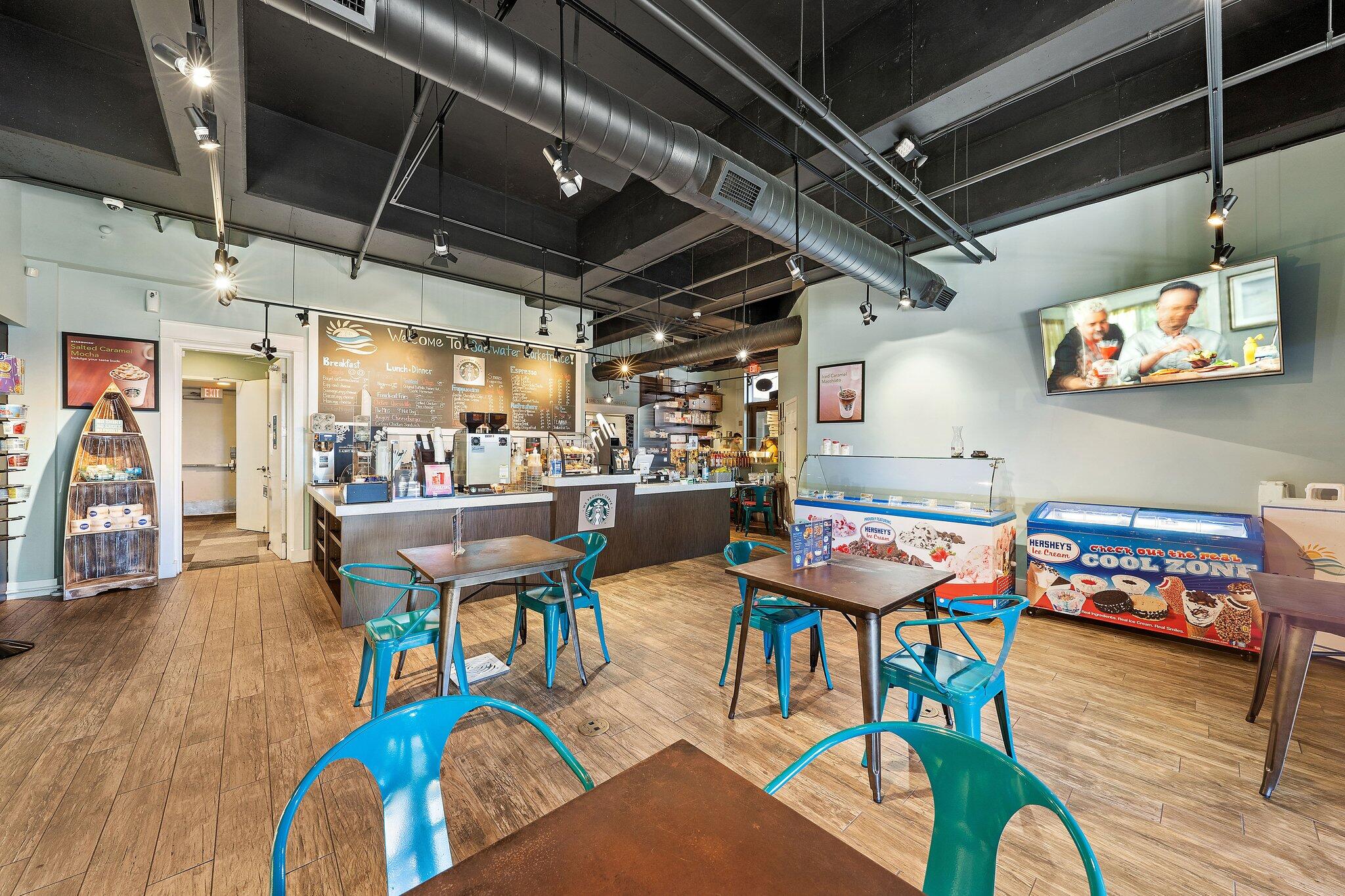 15100 Front Beach Road, Unit 1302 Panama City Beach, FL 32413 - Photo 62 of 67 a outdoor dining space with furniture and wooden floor