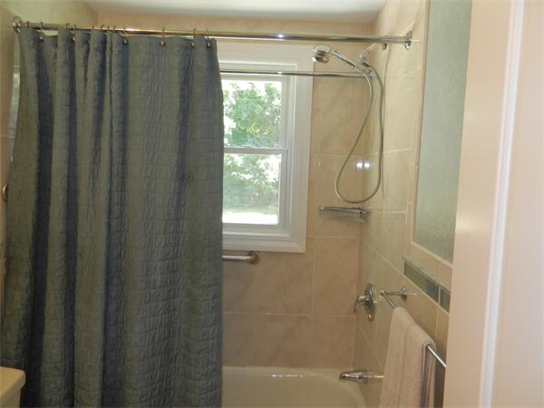 18 Arnold Road Peabody, MA 01960 - Photo 13 of 16 a bathroom with a shower and a glass door shower
