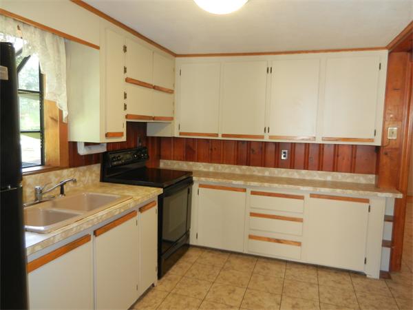 18 Arnold Road Peabody, MA 01960 - Photo 6 of 16 a kitchen that has a sink and a stove in it