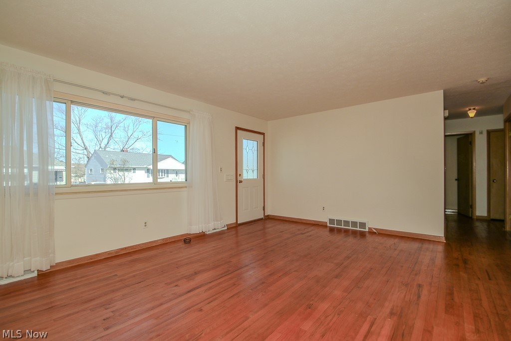 30224 Regent Road Wickliffe, OH 44092 - Photo 2 of 27 Spare room with wood finished floors and baseboards
