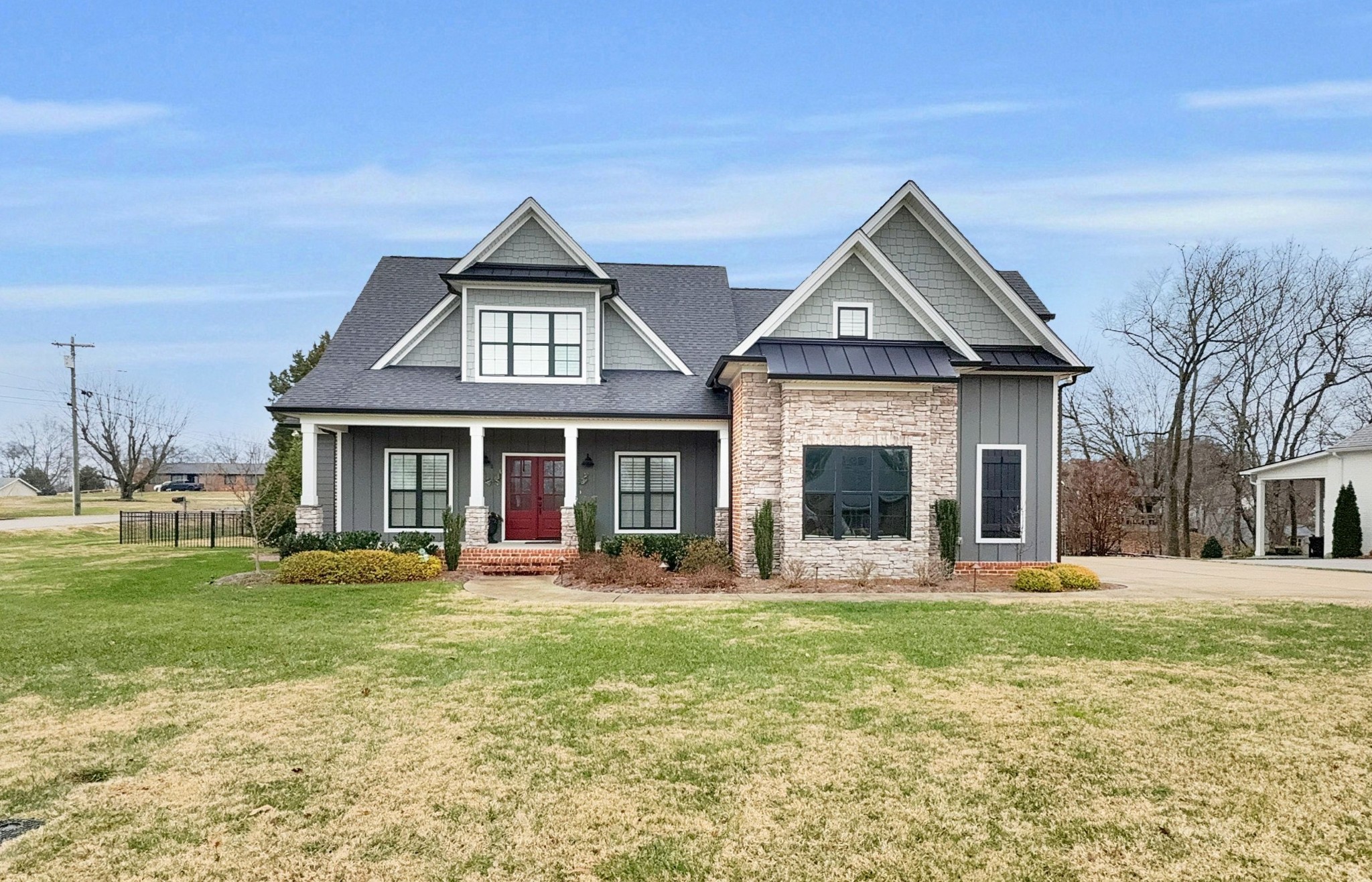 a front view of a house with a yard