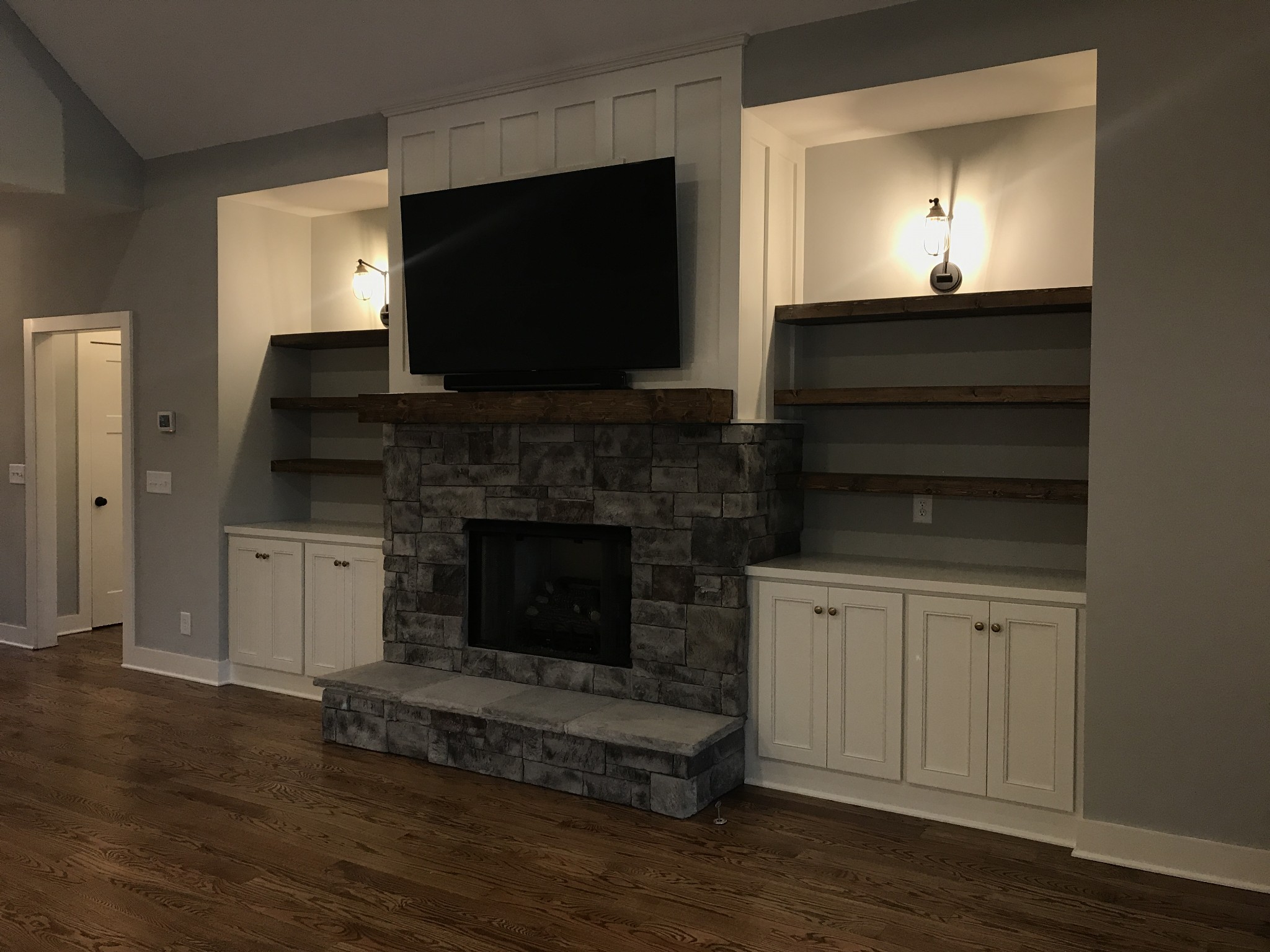205 Old Horn Springs Road Lebanon, TN 37087 - Photo 11 of 27 a living room with a fireplace and a flat screen tv
