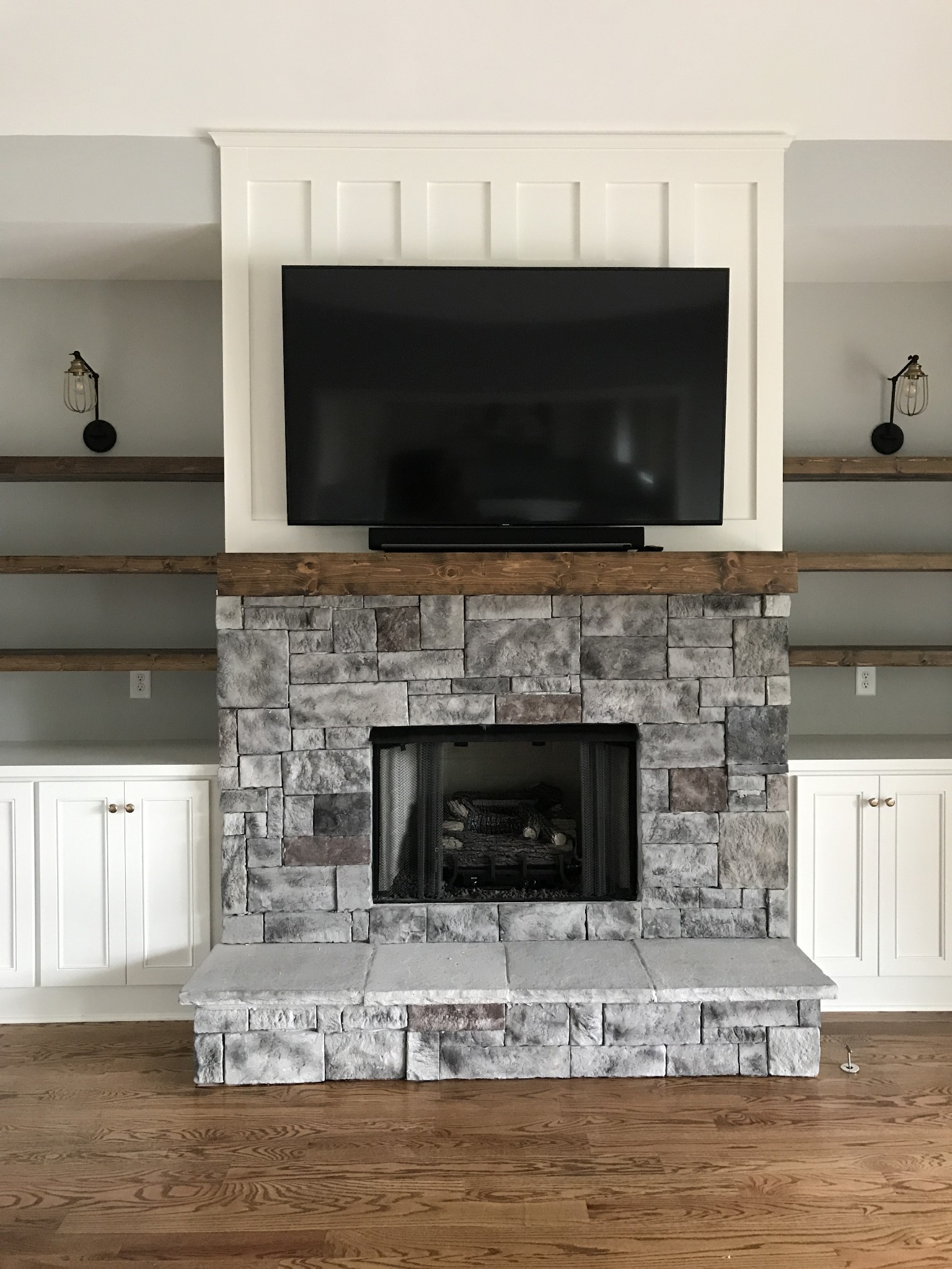 205 Old Horn Springs Road Lebanon, TN 37087 - Photo 17 of 27 a living room with a fireplace and a flat screen tv