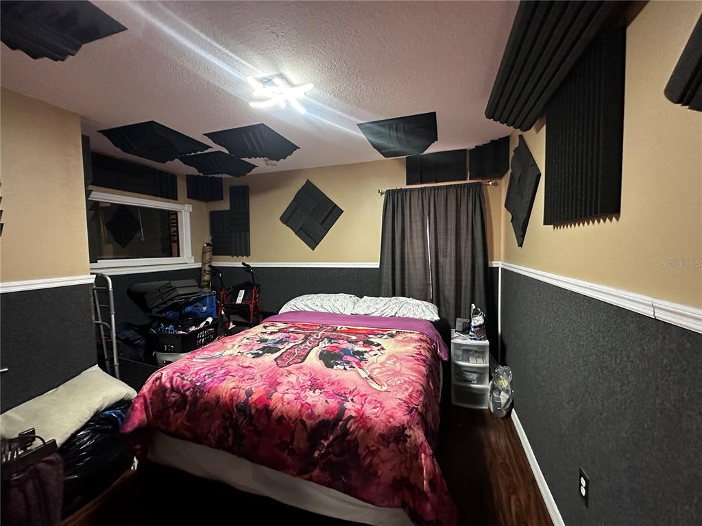 15040 Southwest 39th Circle Ocala, FL 34473 - Photo 14 of 23 a bed sitting in a bedroom next to a window