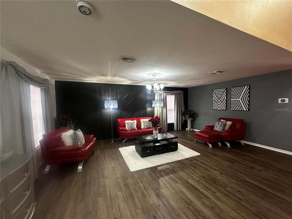 15040 Southwest 39th Circle Ocala, FL 34473 - Photo 6 of 23 a living room with furniture and a pool table