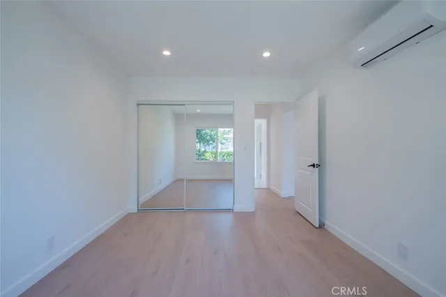 a view of a backyard with plants and a small yard